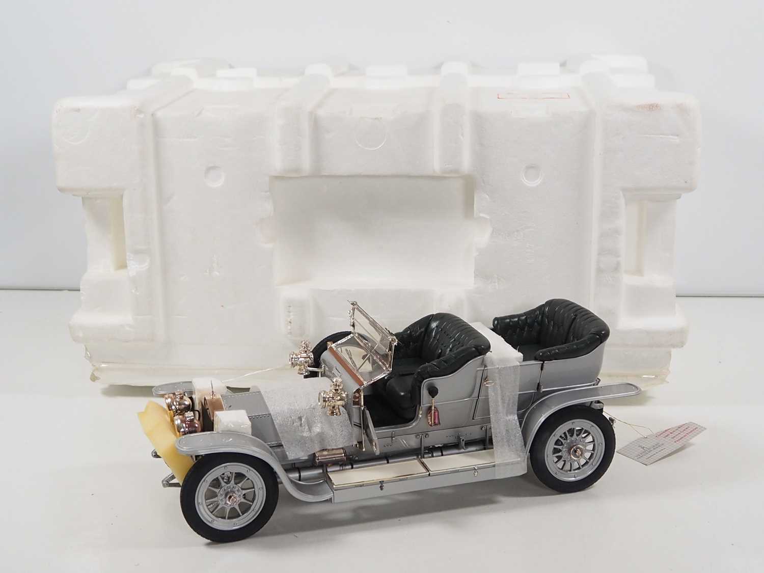 A FRANKLIN MINT 1:12 scale diecast 1907 Rolls Royce Silver Ghost - appears undisplayed in original