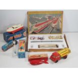 A group of vintage Eastern European plastic and tinplate toys to include a PIKO 3-car monorail set -