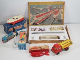 A group of vintage Eastern European plastic and tinplate toys to include a PIKO 3-car monorail set -