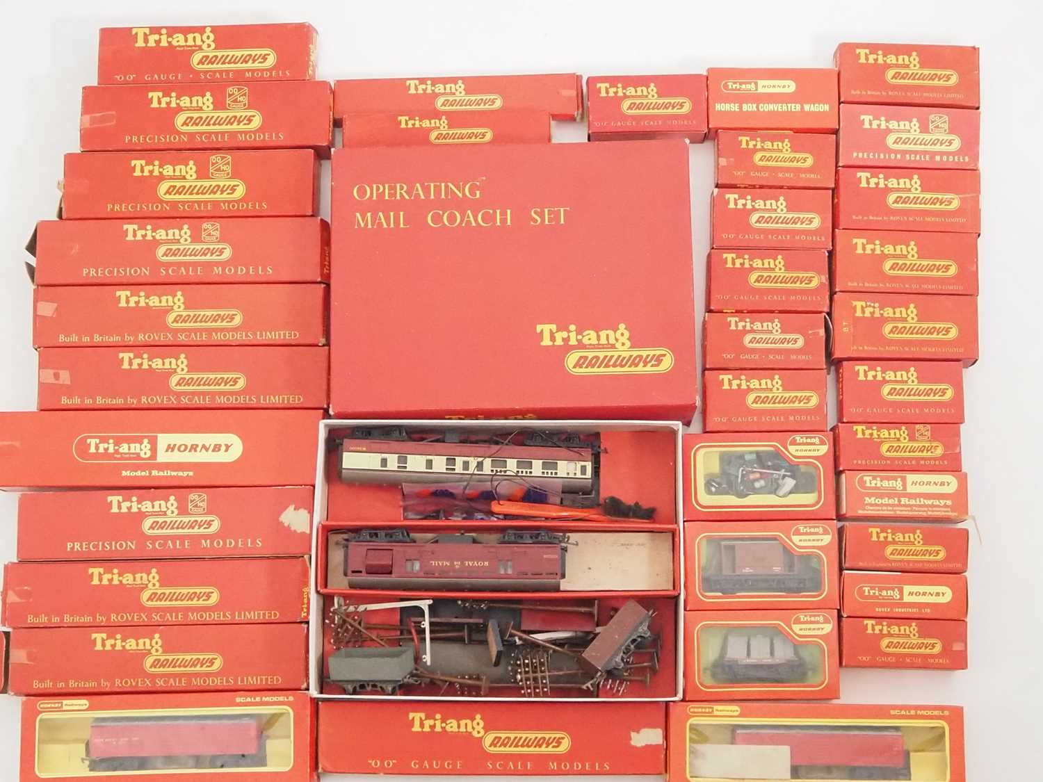 A large group of TRI-ANG OO gauge coaches and wagons, mostly in original boxes, together with an