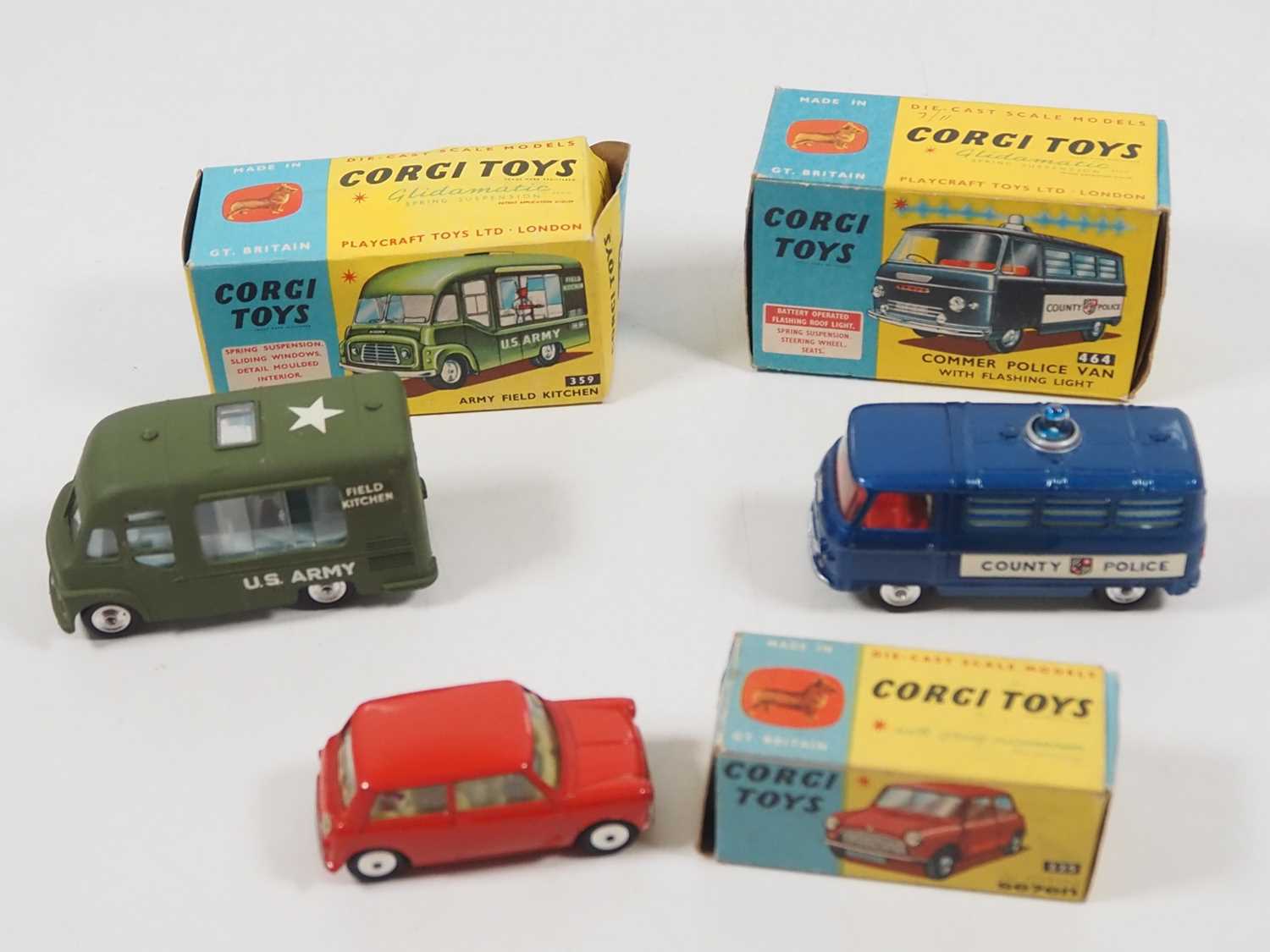 A group of CORGI diecast vehicles comprising a 225 Austin Seven, a 359 Army Field Kitchen and a