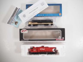 A pair of American and Canadian outline HO gauge diesel locomotives by BACHMANN and ATLAS - VG in