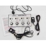 A MORLEY CONTROLLERS OO gauge 4-track Vortrak controller together with two plug in hand controllers,