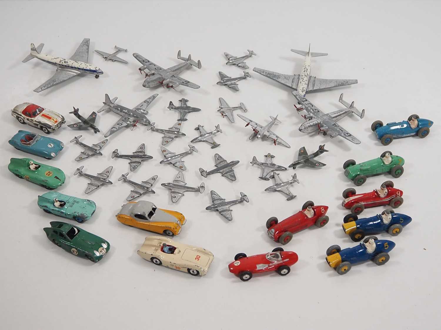 A group of playworn DINKY diecast toys comprising a large selection of aircraft and a group of