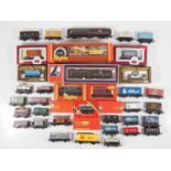 A group of OO gauge boxed and unboxed wagons by HORNBY, MAINLINE and others - G/VG in F/G boxes (