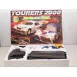 A SCALEXTRIC 'Tourers 2000' slot racing set, appears complete - VG in G box