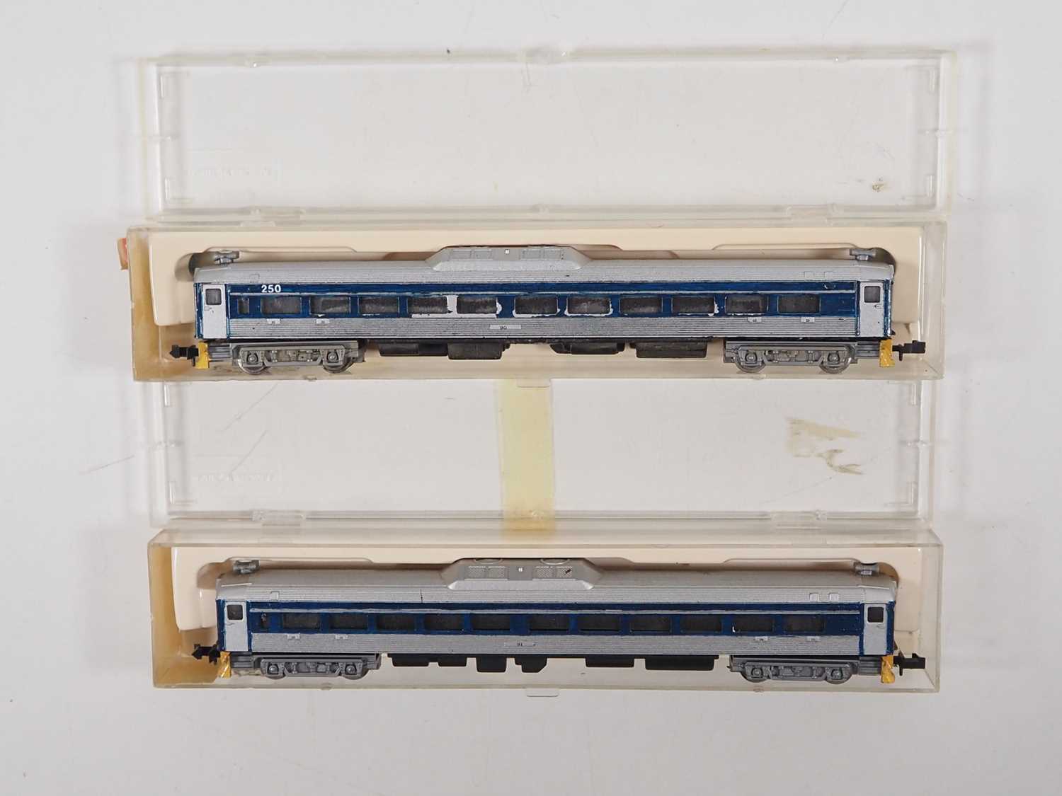 A pair of N gauge CON-COR American outline Budd RDC railcars comprising a powered and dummy version,