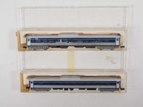 A pair of N gauge CON-COR American outline Budd RDC railcars comprising a powered and dummy version,