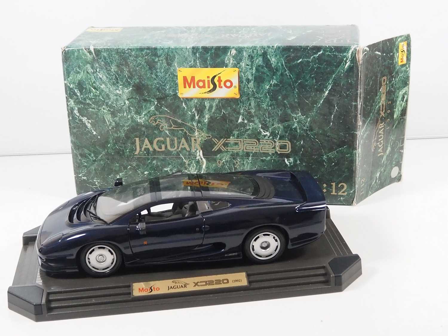 A very mixed group of diecast cars comprising a MAISTO 1:12 scale Jaguar XJ220, a GUILOY 1:18 - Image 4 of 5