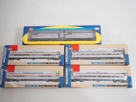 An ATHEARN American outline HO gauge F7A diesel locomotive pair together with a group of WALTHERS