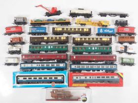 A group of OO gauge rolling stock by HORNBY, AIRFIX and others together with an OXFORD DIECAST low