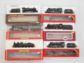 A group of OO gauge steam locomotives by HORNBY, MAINLINE and DAPOL in GWR, SR and LNER liveries -