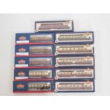 A group of BACHMANN boxed OO gauge coaches in various liveries, some fitted with NEM buckeye