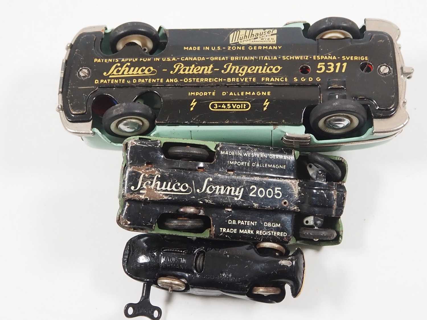 A group of SCHUCO vintage tinplate vehicles comprising a boxed submarine and three cars - F/G in F/G - Image 4 of 6