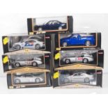 A mixed group of MAISTO 1:18 scale diecast cars including several racing examples - all as new -