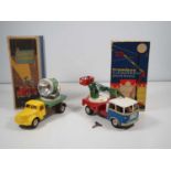 A pair of boxed vintage Czechoslovakian clockwork operated tinplate and plastic vehicles by IGLA