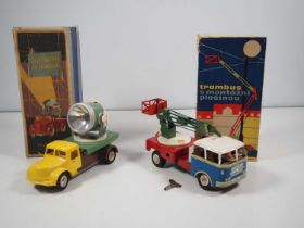 A pair of boxed vintage Czechoslovakian clockwork operated tinplate and plastic vehicles by IGLA