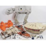 A large group of vintage PALITOY/KENNER Star Wars toys to include a Millennium Falcon, AT-AT and