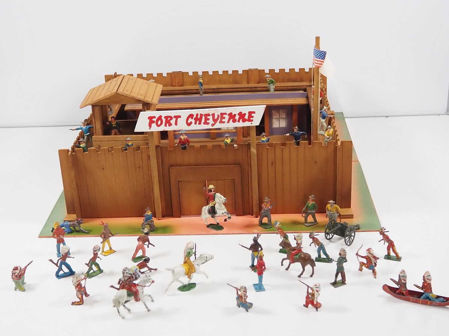 A group of diecast Cowboys and Indians by TIMPO and others together with a 1950s ELF TOYS wooden '