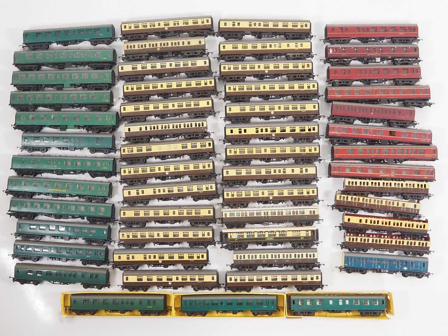 A very large quantity of unboxed mostly TRI-ANG TT gauge coaches, in various liveries - F/G