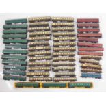 A very large quantity of unboxed mostly TRI-ANG TT gauge coaches, in various liveries - F/G