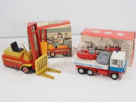 A pair of Czechoslovakian vintage tinplate and plastic friction drive vehicles comprising a