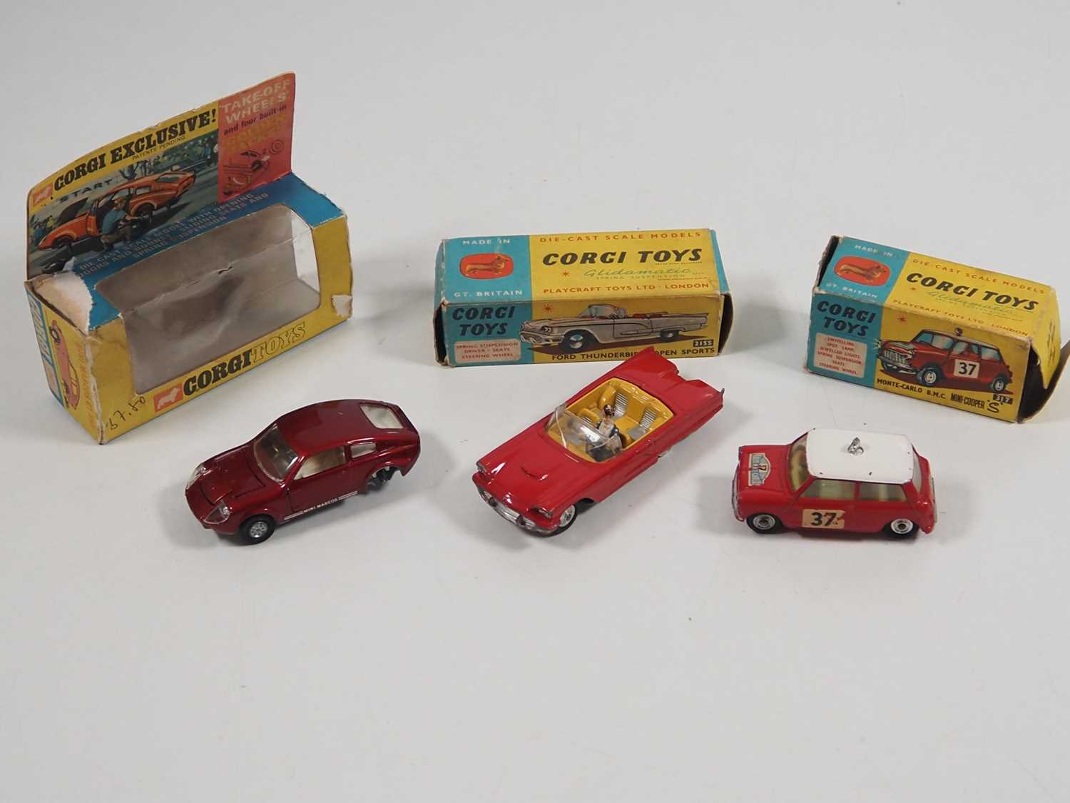 A group of CORGI diecast cars comprising 215S (one tyre missing), 317 and 341(one wheel missing) -