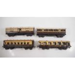 A group of O gauge coaches comprising a pair of MARKLIN LNWR bogie coaches together with a pair of