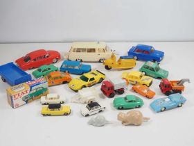 A group of Eastern European plastic and metal toy vehicles, mostly unboxed to include a friction