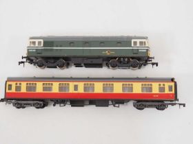 A LIMA O gauge class 33 diesel in BR green together with a Mark 1 coach (chip to one end of