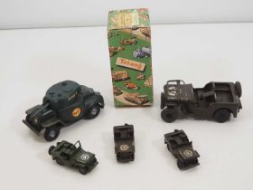 A group of vintage TRIANG MINIC clockwork military vehicles comprising 3 x small Jeeps and a large