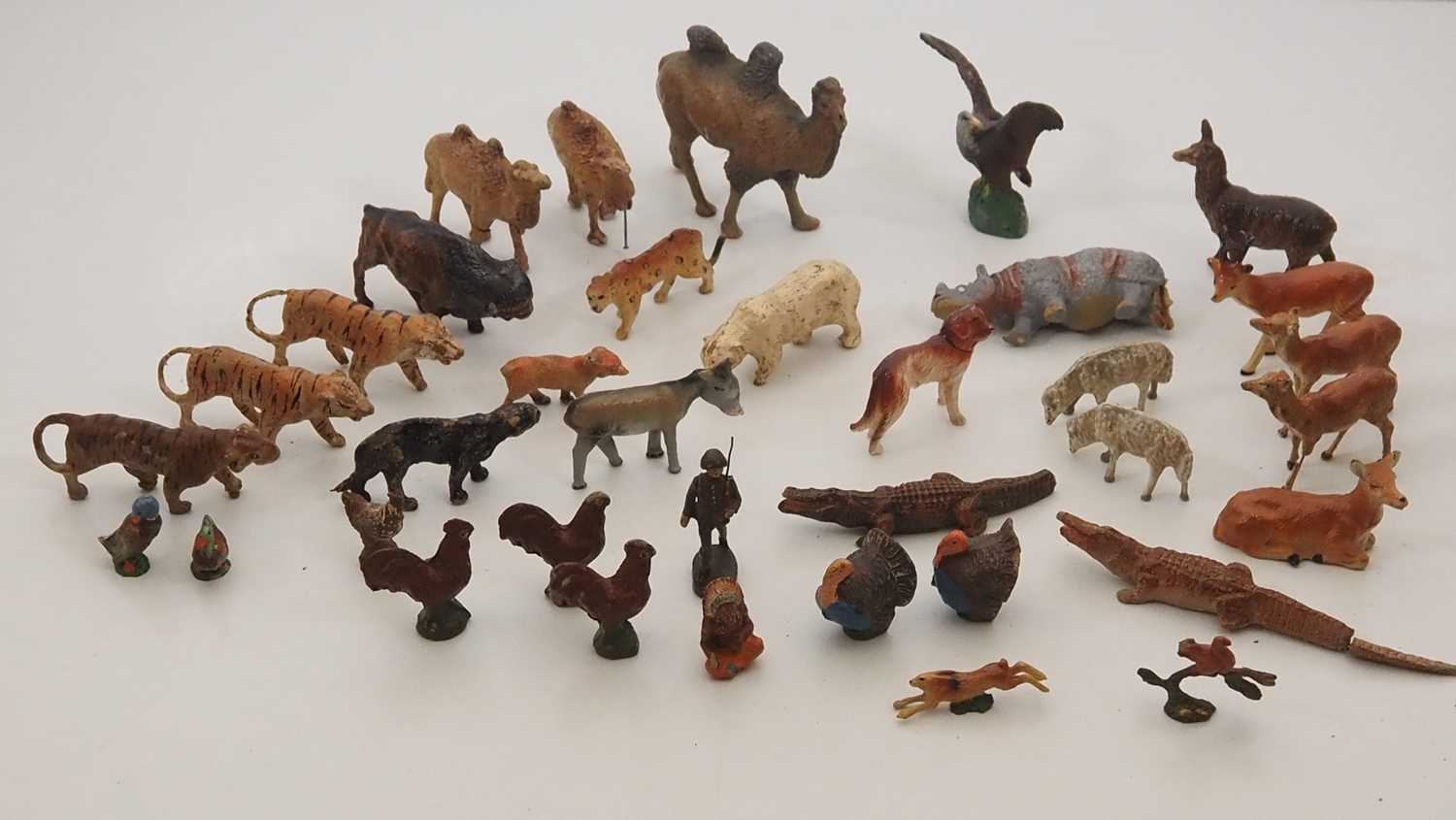 A large quantity of vintage elastolin-based toy animals including tigers, camels, rhinoceroses etc -