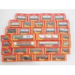 A large group of HORNBY boxed OO gauge wagons of various types including hoppers and Freightliners -