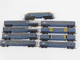 A group of TRI-ANG OO gauge Transcontinental rolling stock comprising a double ended diesel and rake