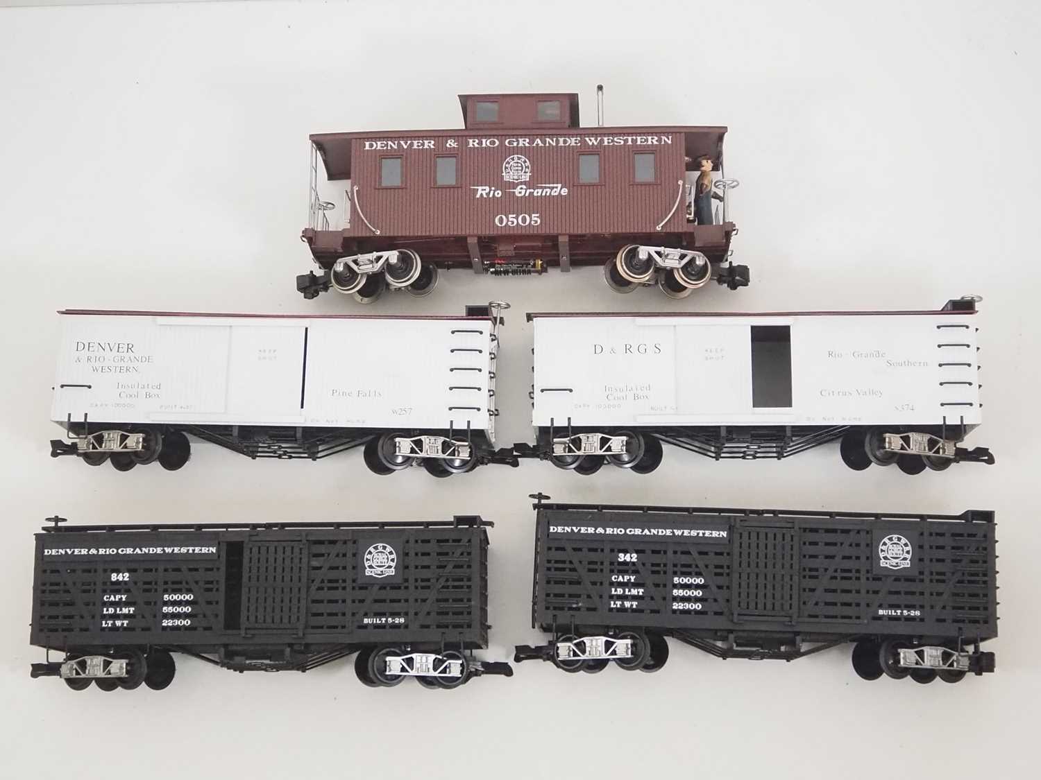 A group of G scale American Outline box cars and a caboose by BACHMANN most with upgraded running