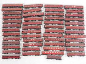 A very large quantity of unboxed mostly TRI-ANG TT gauge coaches, all in maroon livery - F/G unboxed