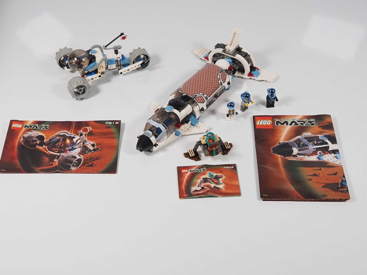 LEGO - SPACE - A group of three Life On Mars sets comprising #7302 Worker Robot and #7312 T3 Trike