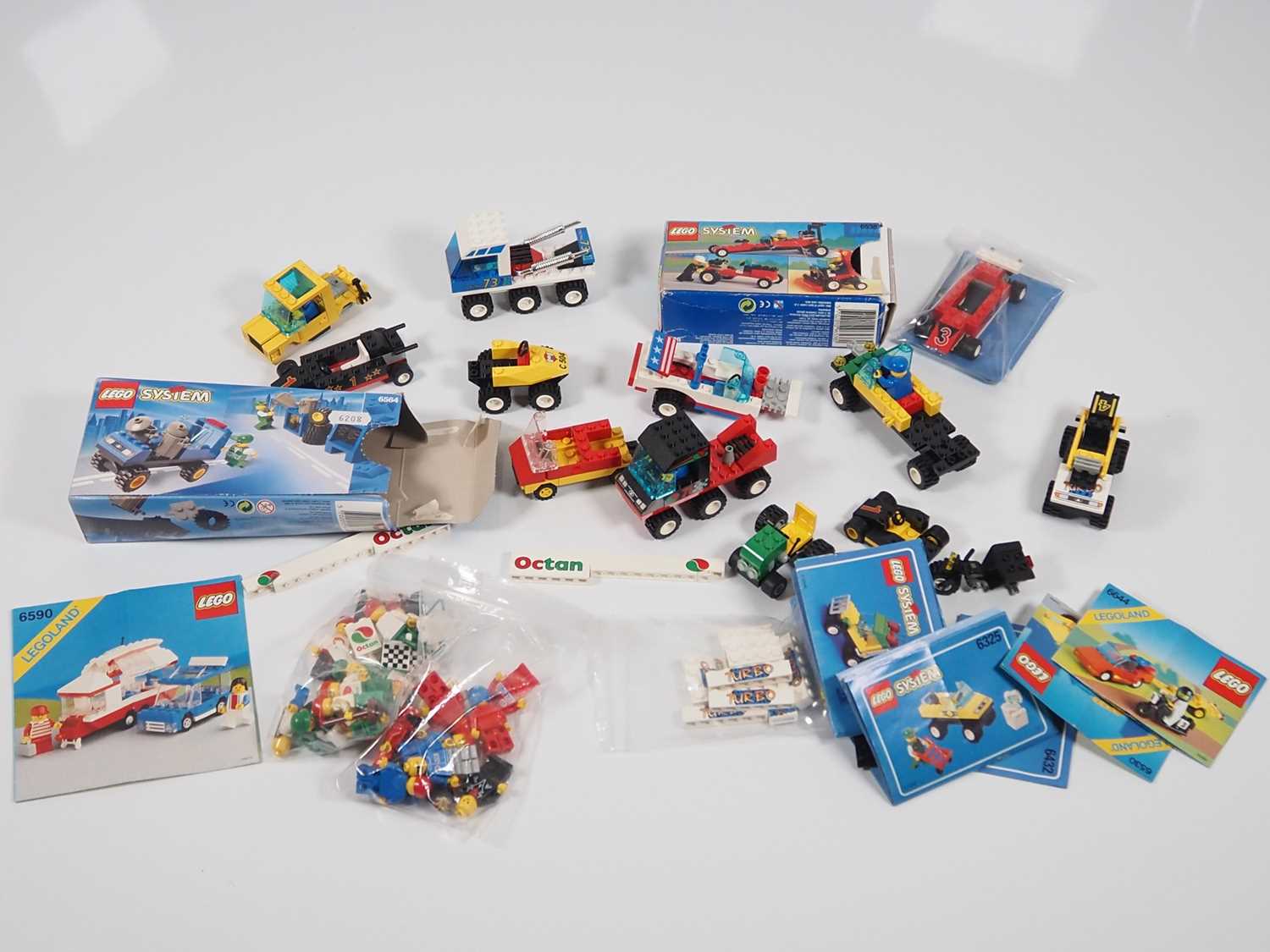 LEGO - A Large quantity of vintage vehicles and vehicle parts with a selection of instruction