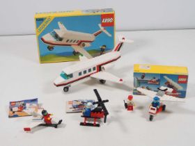 LEGO - CLASSIC TOWN - A group of four Airport sets comprising #2849 (unboxed), #2884 (missing blue