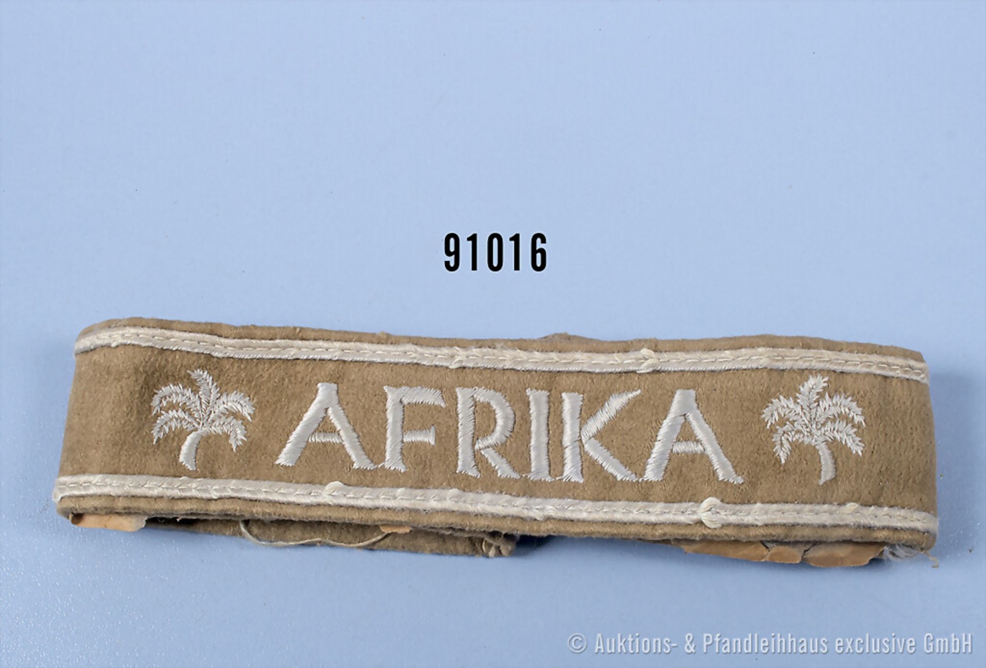 Ärmelband Afrika, Kamelhaarausf., L ca. 46 cm, an den Enden Papierklebereste, guter ...