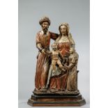 Sainte Famille : Joseph portant un turban et une longue robe debout à côté de Sainte Anne assise