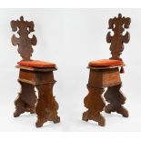 Pair of carved wooden stools, 17th century