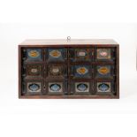 Coin cabinet with six drawers decorated with twelve paintings under glass, 18th century