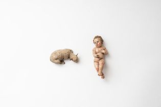 Two ancient Neapolitan nativity scene sculptures depicting a baby and a sheep