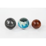 Lot consisting of three spheres: two in plexiglass and one in wood, 20th century
