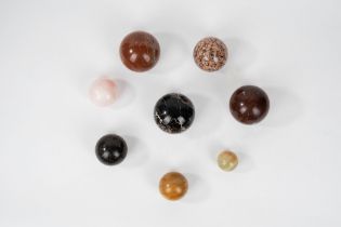 Lot composed of eight spheres in various marbles, 20th century