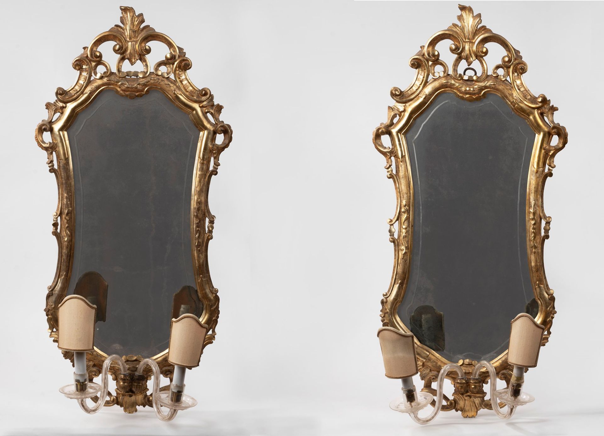 Pair of carved and gilded wooden mirrors, 20th century