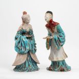 Two polychrome terracotta sculptures depicting an oriental couple,