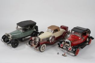 Three model cars with liquor inside