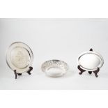 Lot consisting of two plates and a silver centrepiece, 20th century
